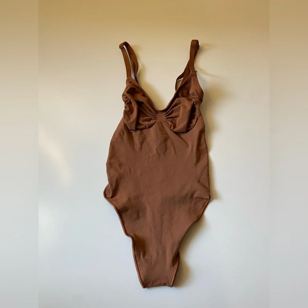 Skims Seamless Sculpting Thong Bodysuit in Bronze